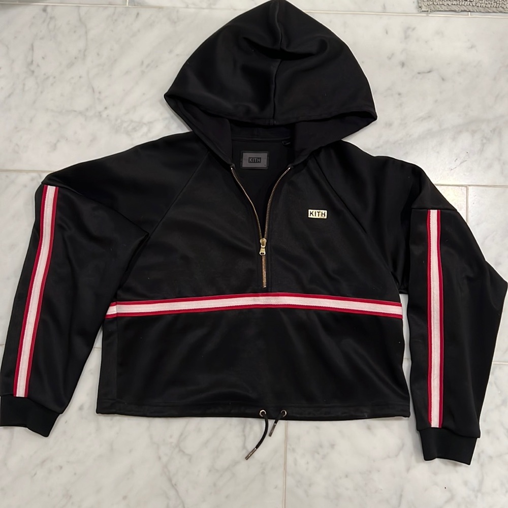 KITH women’s crop black nylon hoodie with red & white arm stripe. Size small.
